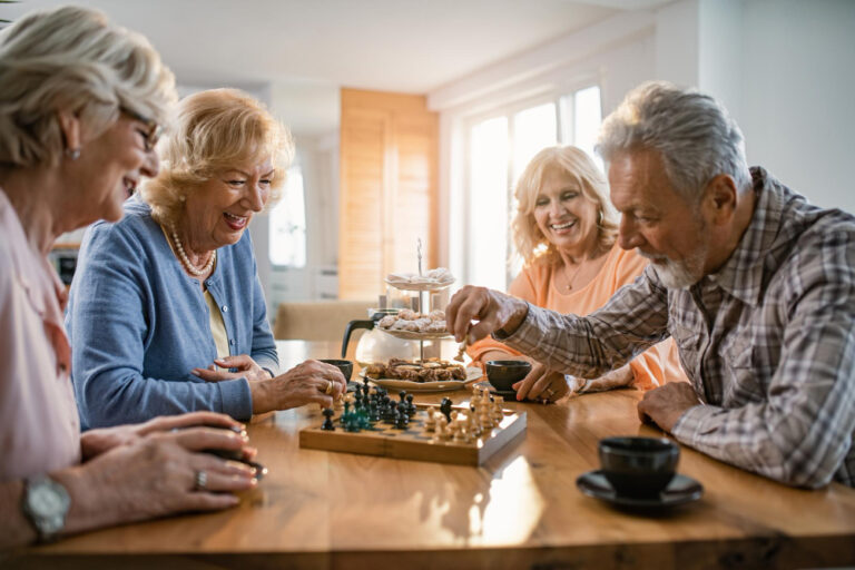 group of seniors playing games and socializing together