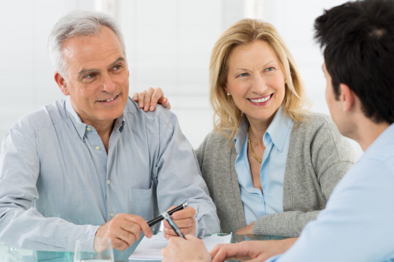 senior couple reviewing financial plans and paperwork together