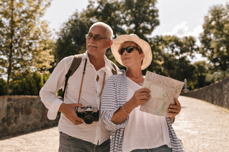 senior couple traveling and enjoying retirement lifestyle after financial planning