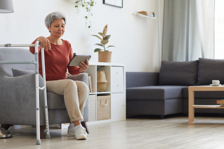 senior woman relaxing in living room at home