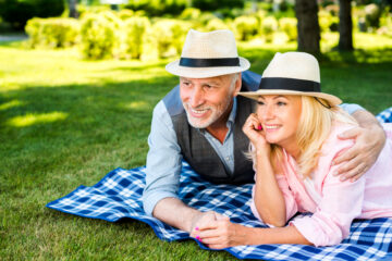 happy senior couple enjoying retirement outdoors after planning for their future